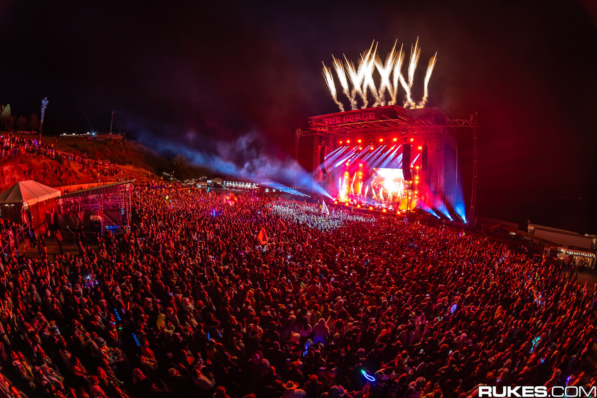 Gorge Pit Night 1 Illenium 2024 with fireworks shooting above the stage and fire from the stage.