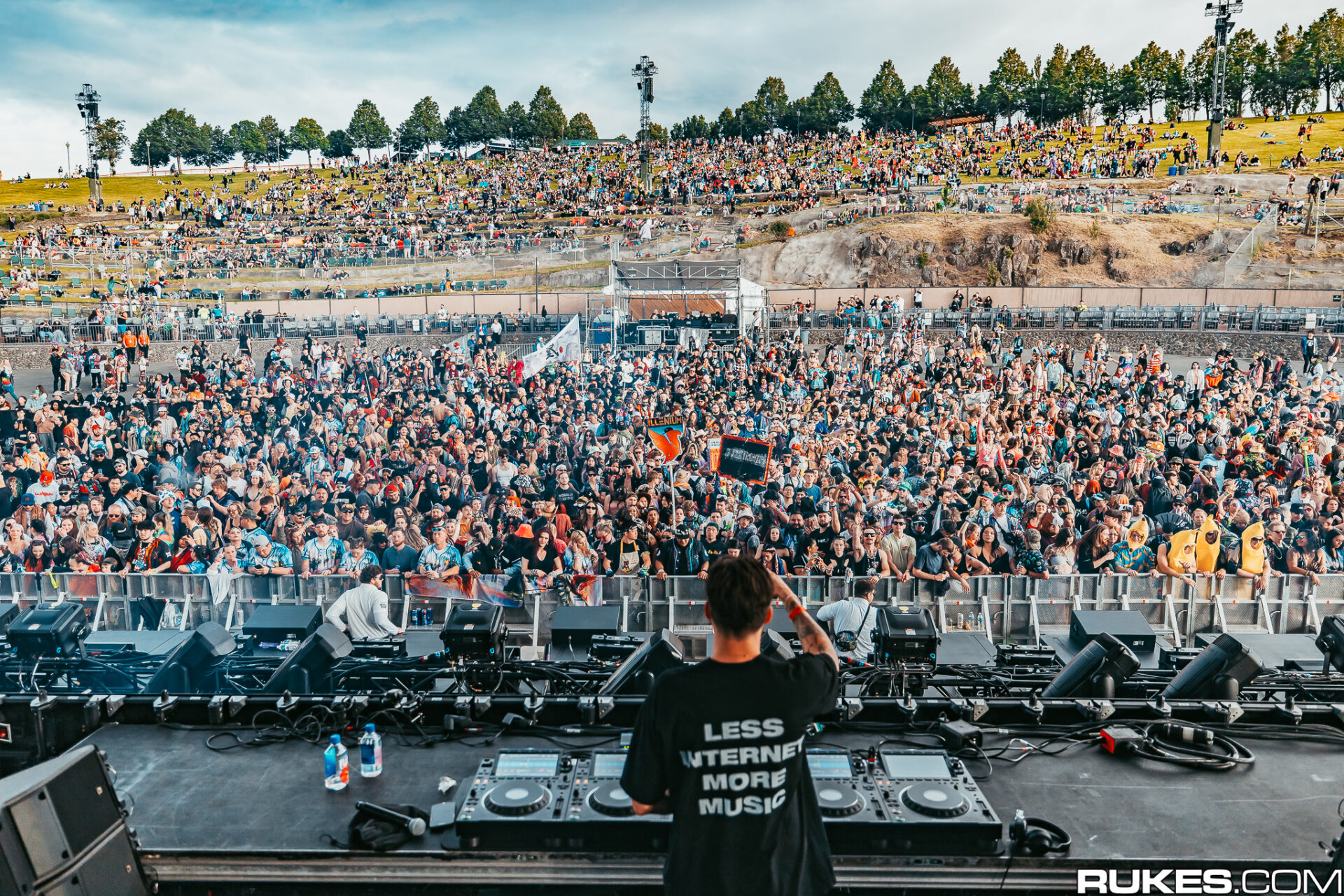 Shot behind BIjou performing at Gorge 2024 with crowd in the background daytime.